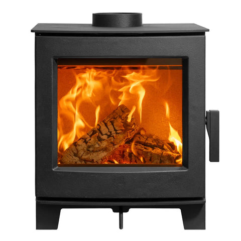 Wood burning stove with a large glass front displaying a vibrant fire and logs inside.