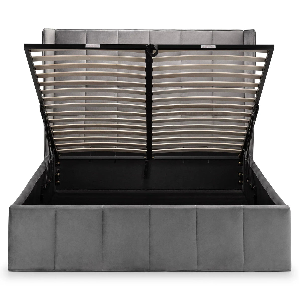 Grey ottoman bed with open lift-up storage, upholstered headboard and slatted base visible
