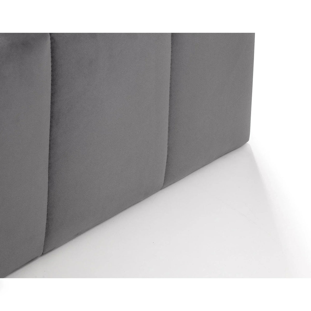 Close up of grey upholstered ottoman bed fabric base panel