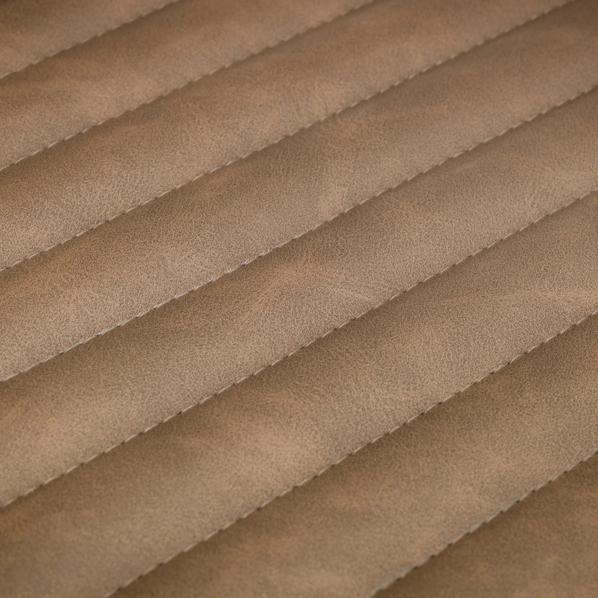 Close up of brown faux leather swivel chair upholstery with horizontal stitched panels