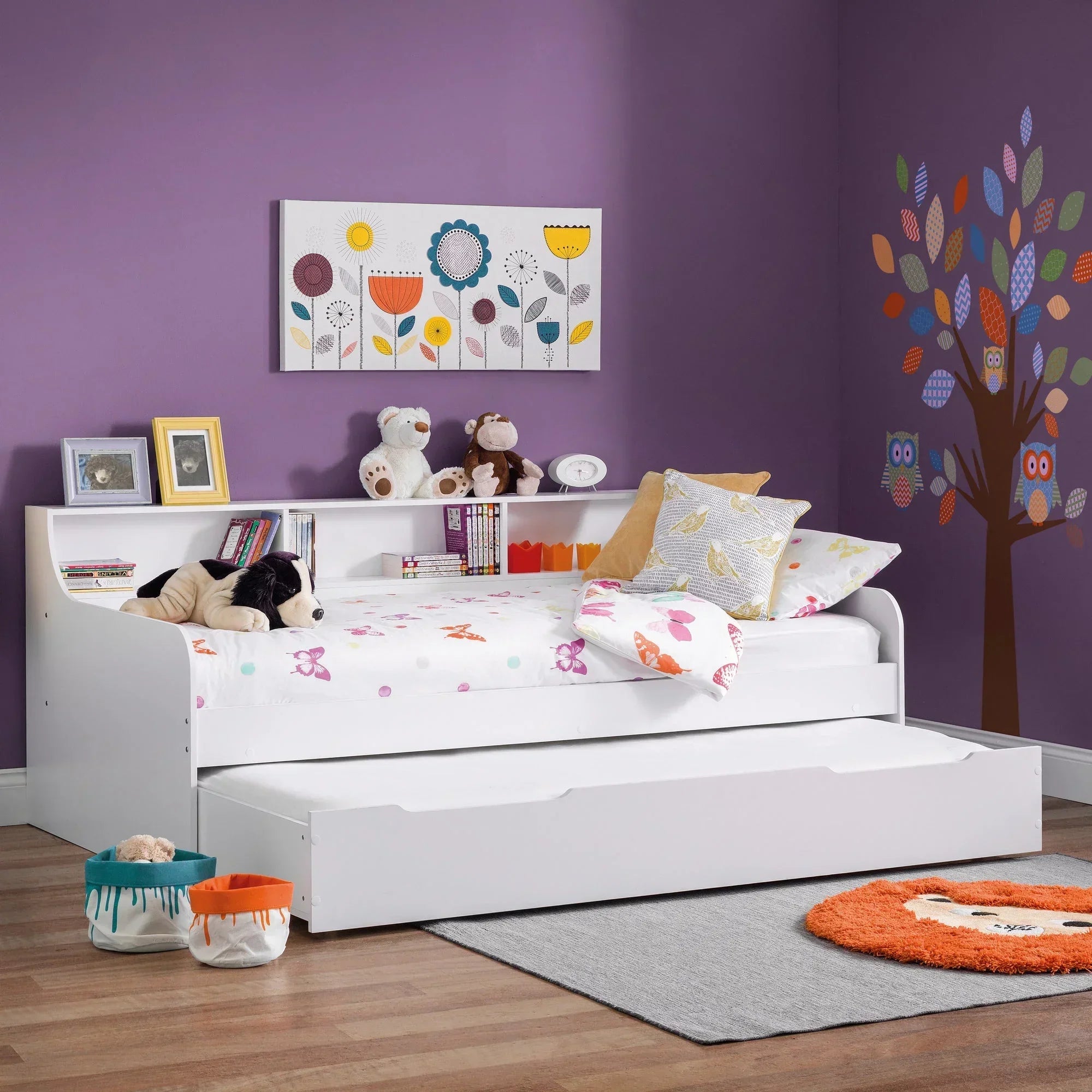 White daybed with trundle, storage headboard, kids bedding in purple themed bedroom