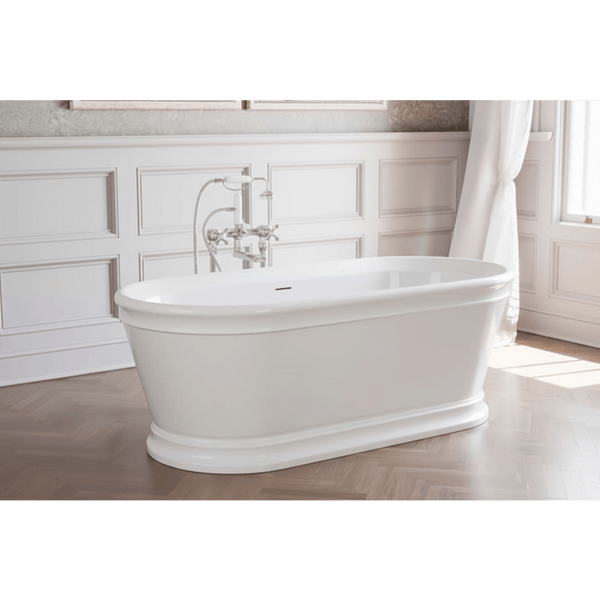White freestanding bathtub in a bathroom with wooden flooring and white walls.
