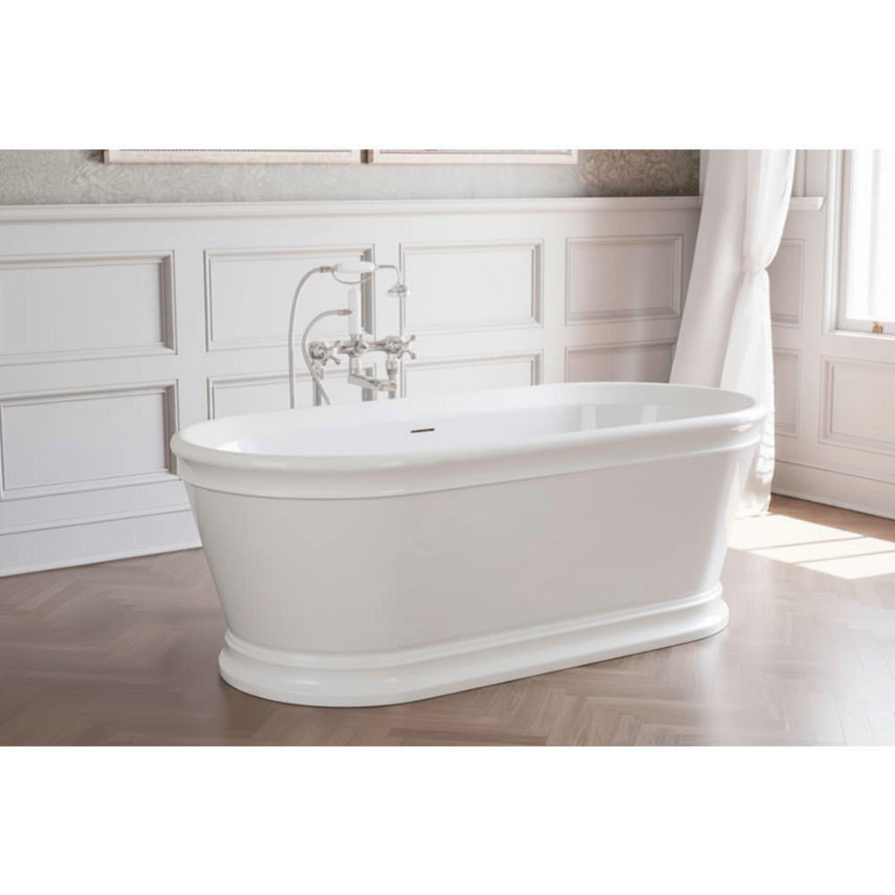 White freestanding bathtub in a bathroom with wooden flooring and white walls.