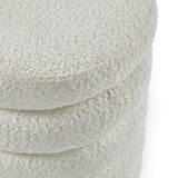 Close up of boucle fabric ottoman in cream with curved, layered design