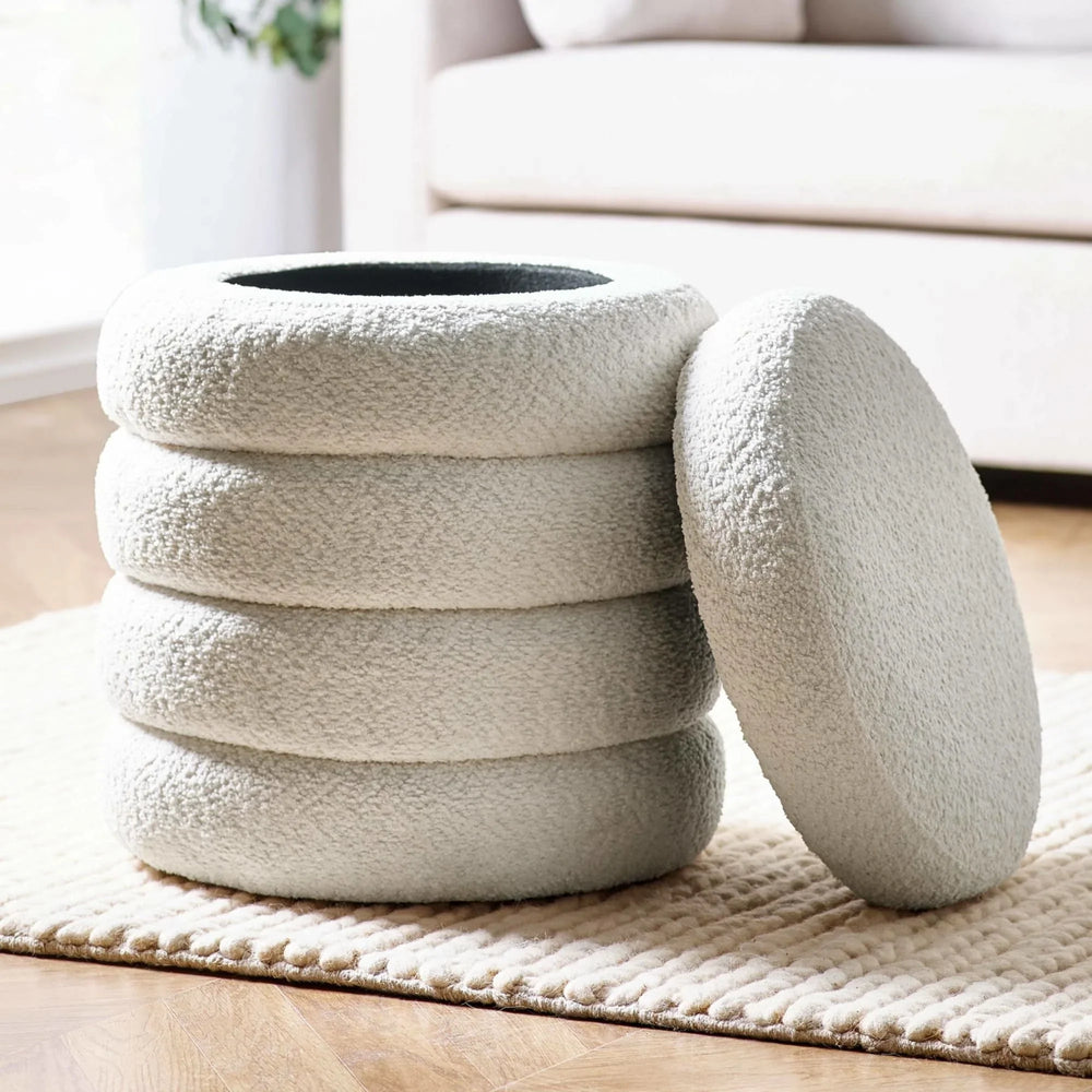 cream boucle storage ottoman with removable lid on textured rug in living room