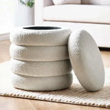 cream boucle storage ottoman with removable lid on textured rug in living room