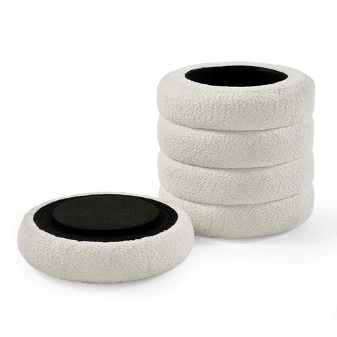 Set of four round boucle seat cushions with black non-slip backing