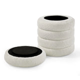 Set of four round boucle seat cushions with black non-slip backing