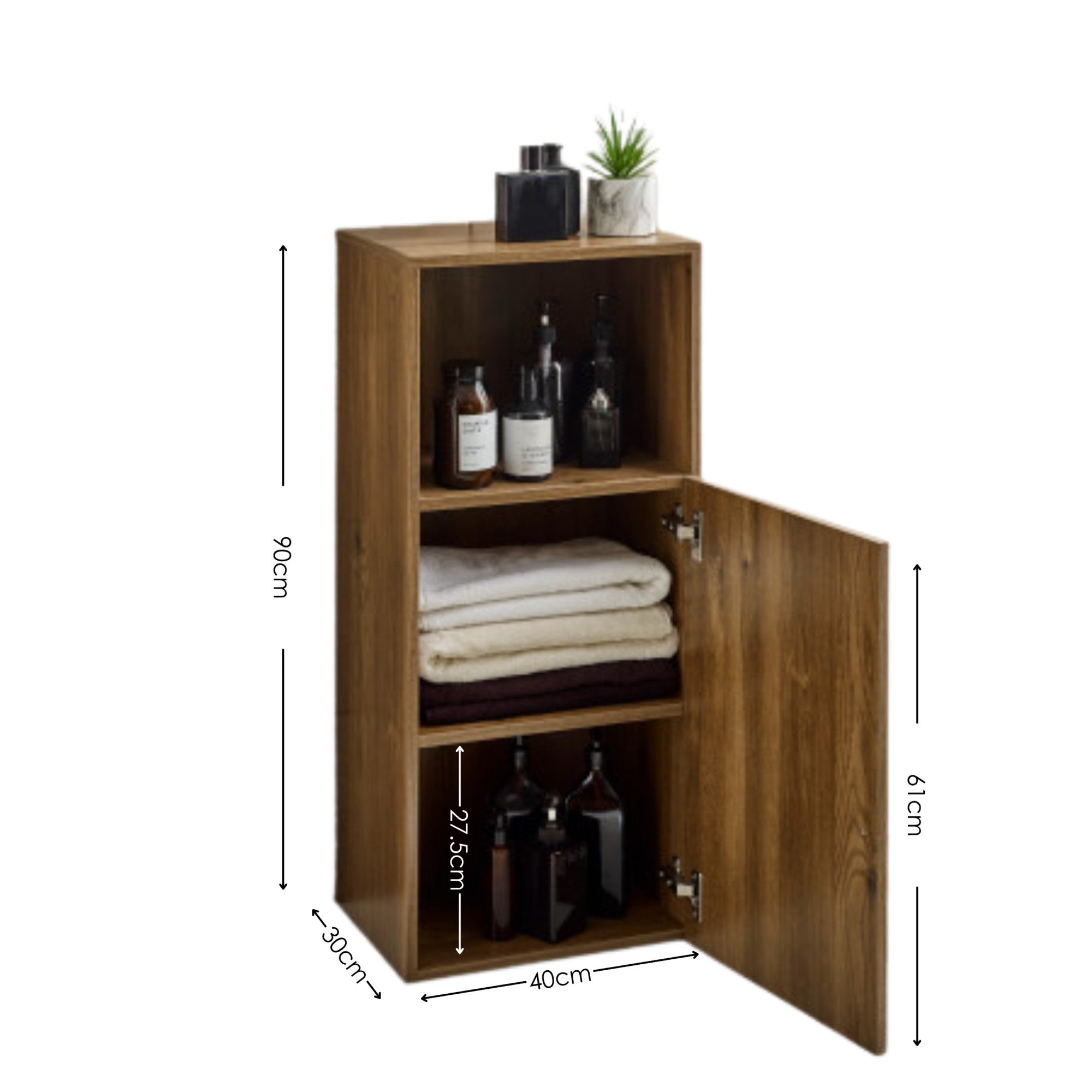 Tall wooden bathroom storage cabinet with open door showing folded towels and bottles on shelves, side angle view