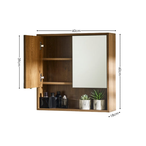 Oak wood bathroom wall cabinet with mirrored door open showing two shelves, decorative plants and bottles, dimensions