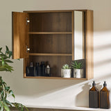 Brown wood bathroom cabinet with both doors open, revealing two shelves behind left door and mirror on right door.