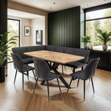 Oak dining table and charcoal dining chairs in green panelled dining room with corner bench
