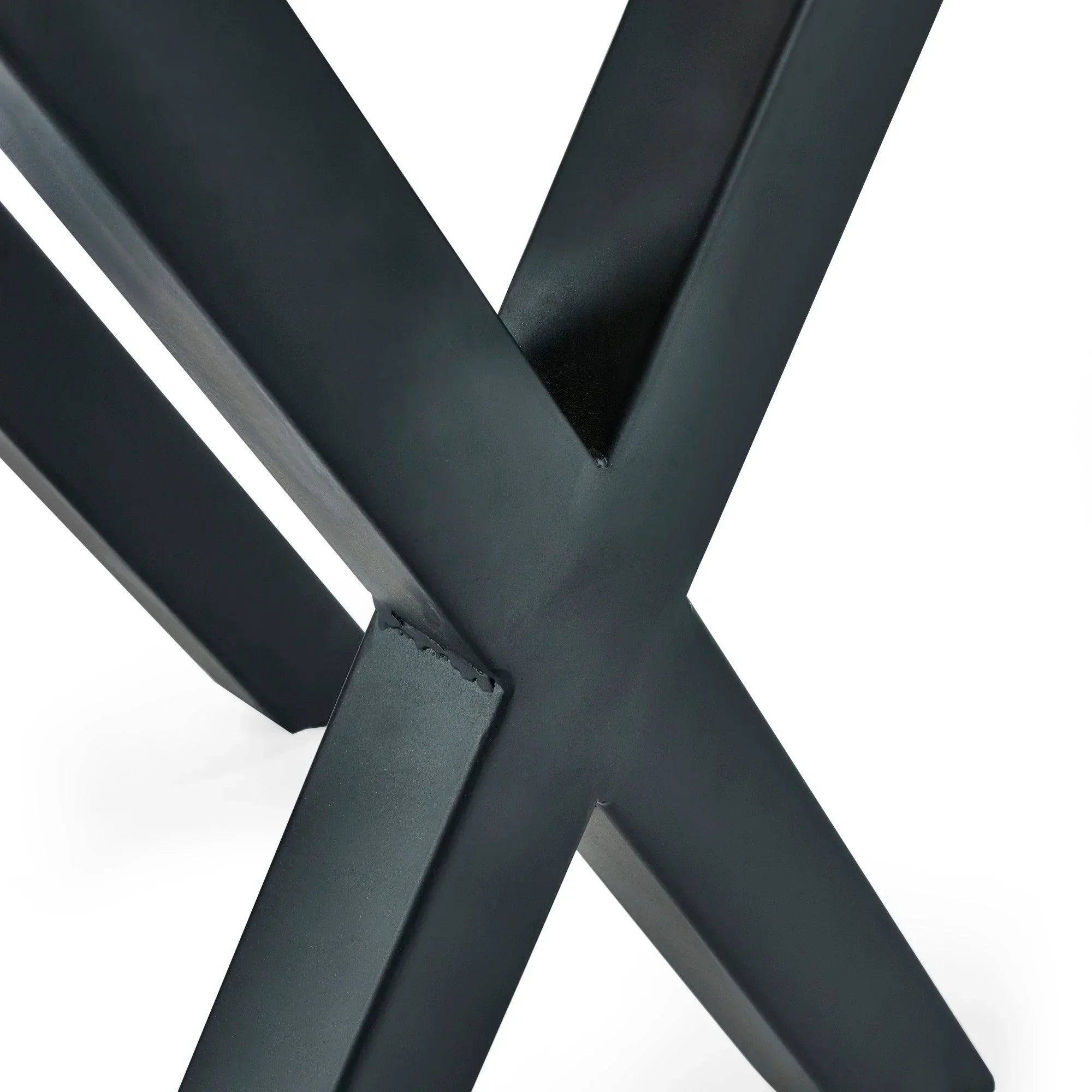 Close-up of black metal table leg with modern cross design on Harvey lamp table
