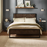 Herringbone patterned headboard and footboard bed in dark wood and black metal frame with bedding in a decorated gray room