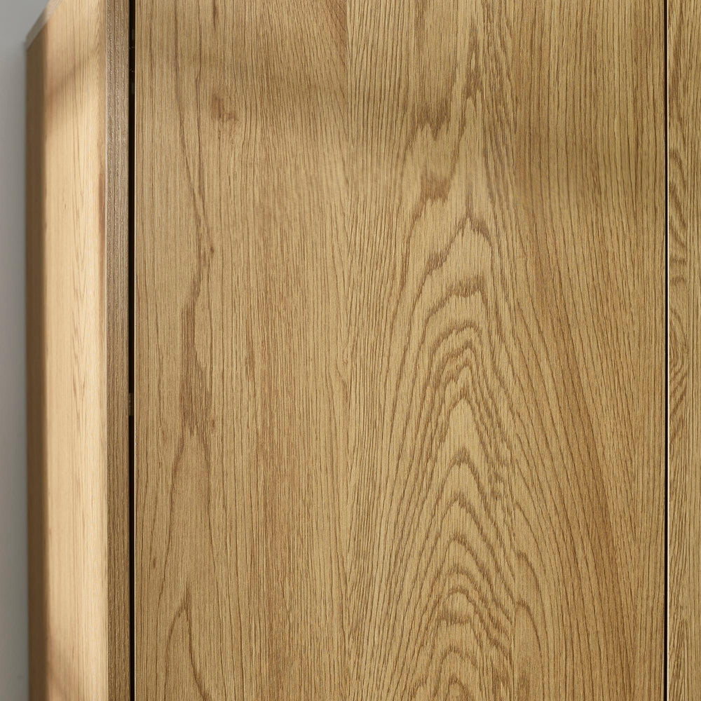 Close up of oak wardrobe doors showing wood grain texture and vertical panel design