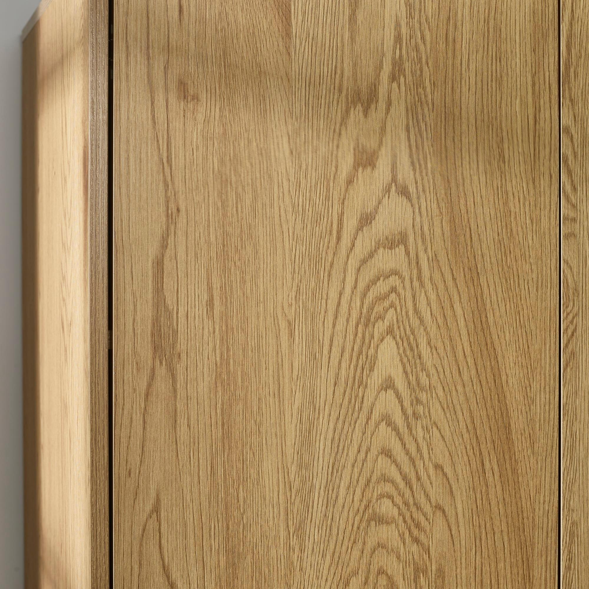 Close up of oak wardrobe doors showing wood grain texture and vertical panel design