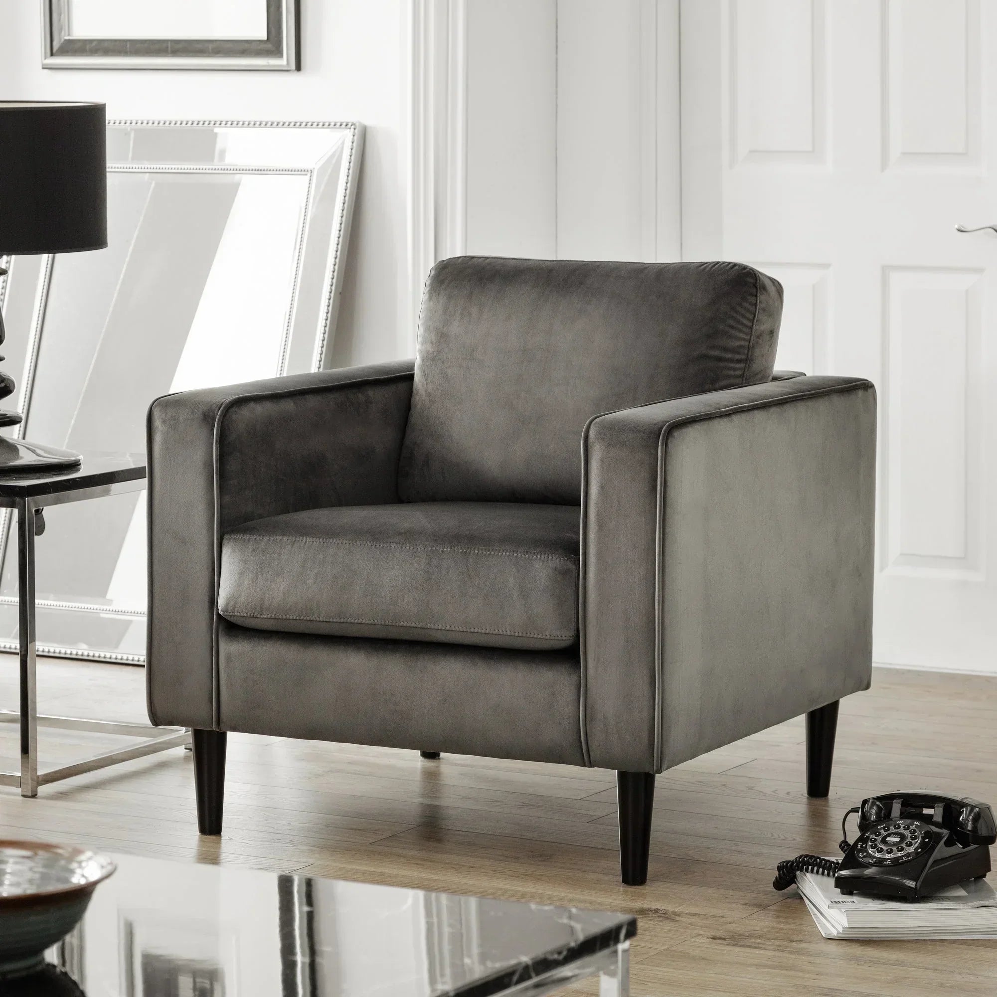 Grey Hayward armchair with slim legs in modern living room with light wood flooring