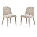 Pair of modern upholstered dining chairs with rounded backs and textured beige fabric