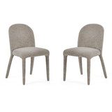 Pair of upholstered dining chairs in light grey boucle fabric with rounded backs and cushioned seats