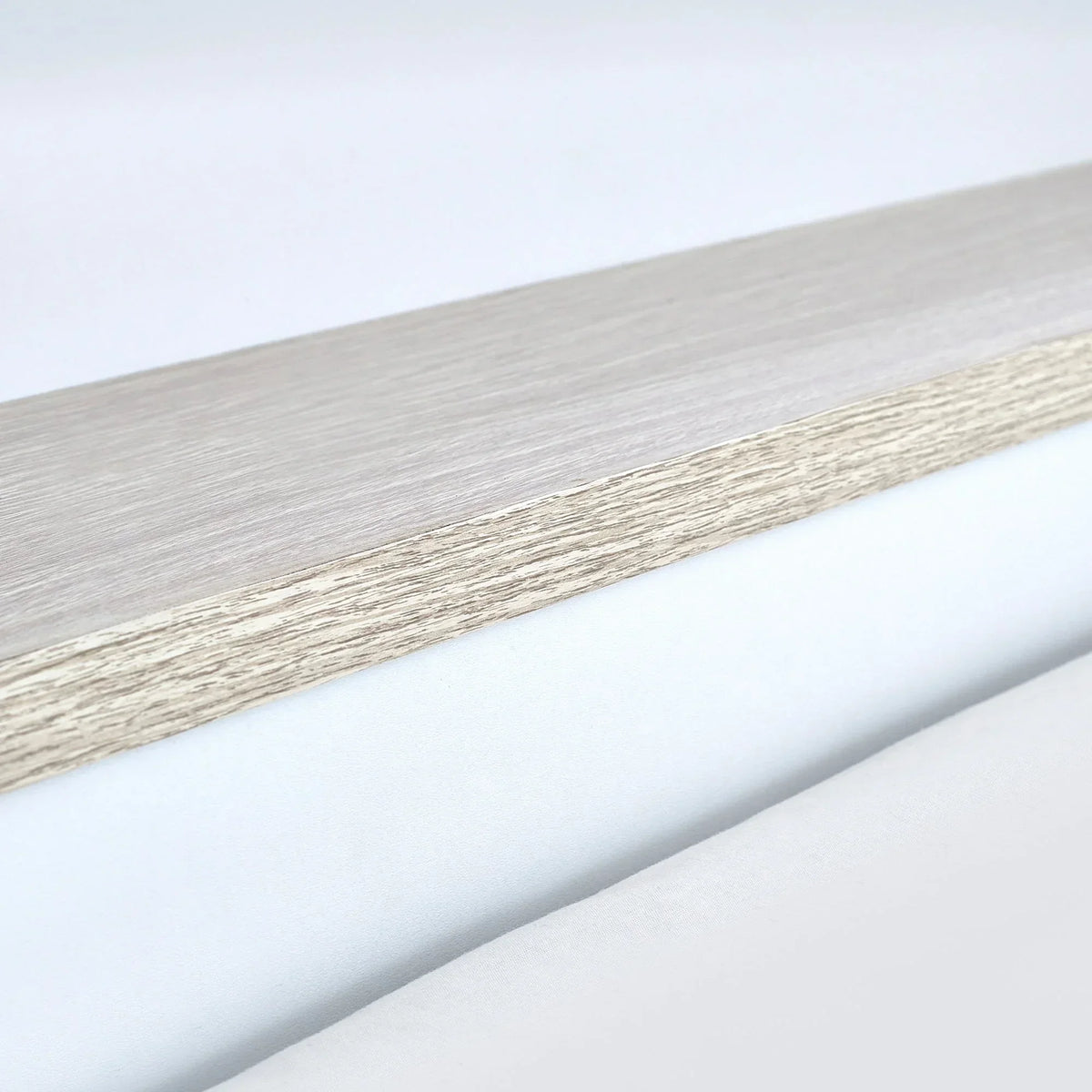 Pale wood bunk bed frame detail with visible grain and light finish