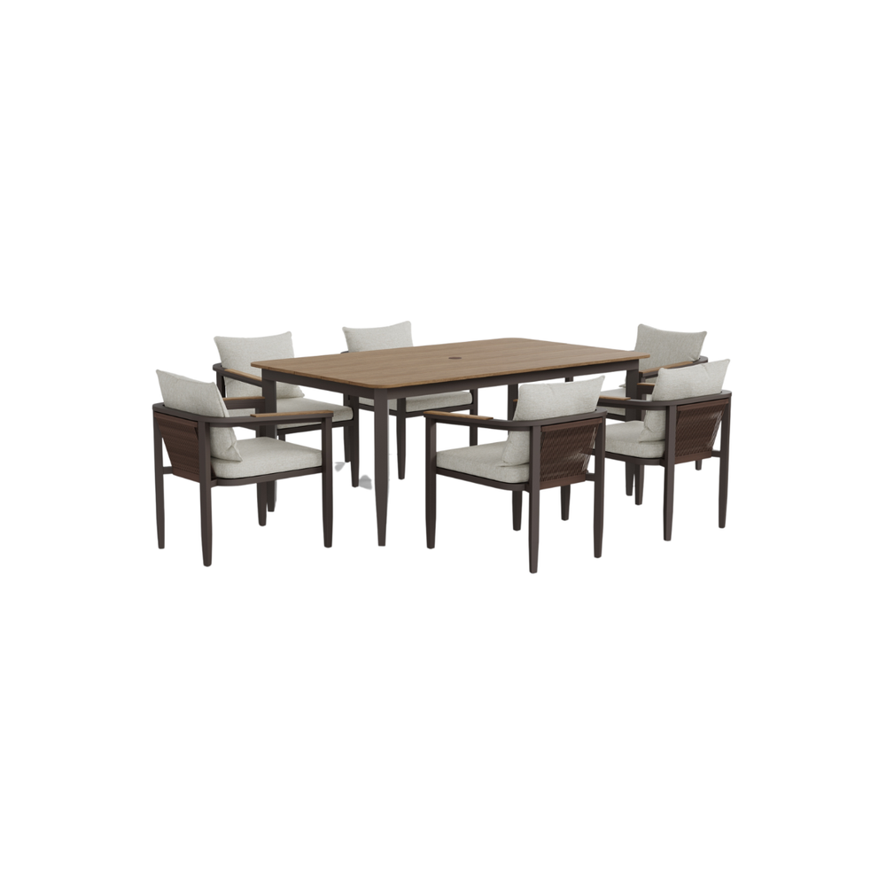 Brown wooden table with dark brown frame and six beige cushioned chairs with armrests.