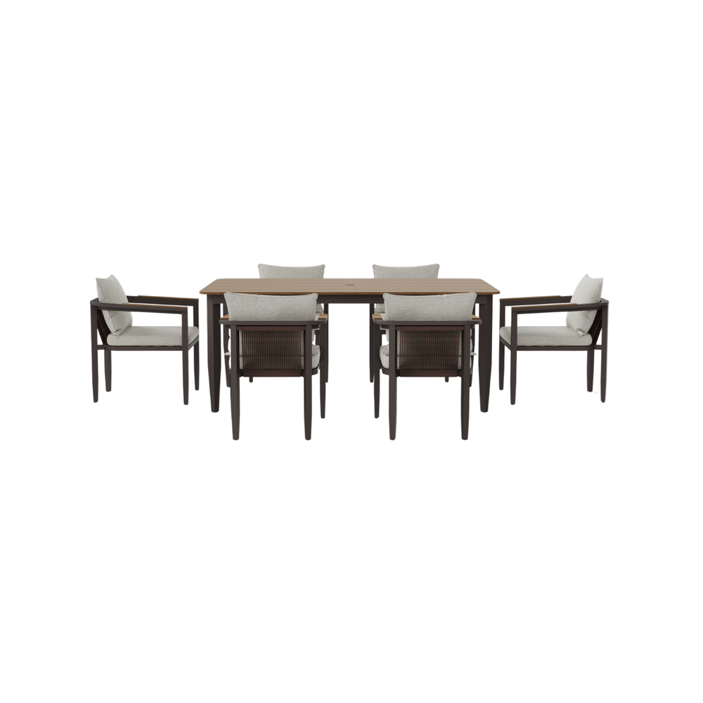 Dark brown wood and beige fabric dining chairs around a wooden rectangular table with slatted top.