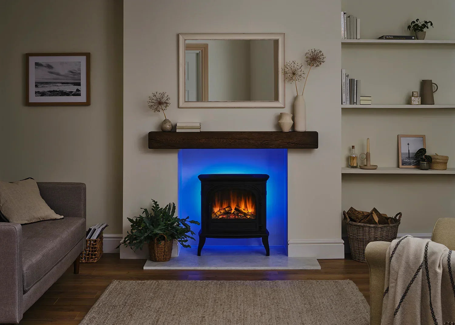 Black stove fireplace with LED flame effect and blue accent lighting in modern living room