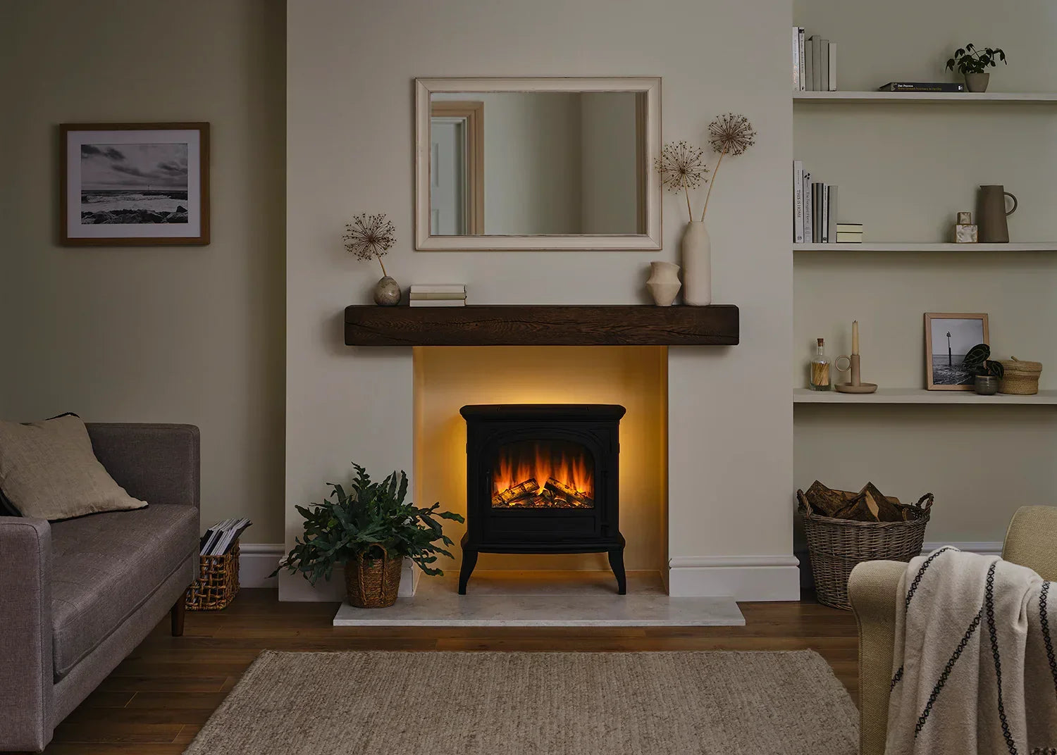 Black freestanding electric stove heater with flame effect in modern living room setting