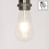 LED filament light bulb with clear glass and visible screw base, switched on