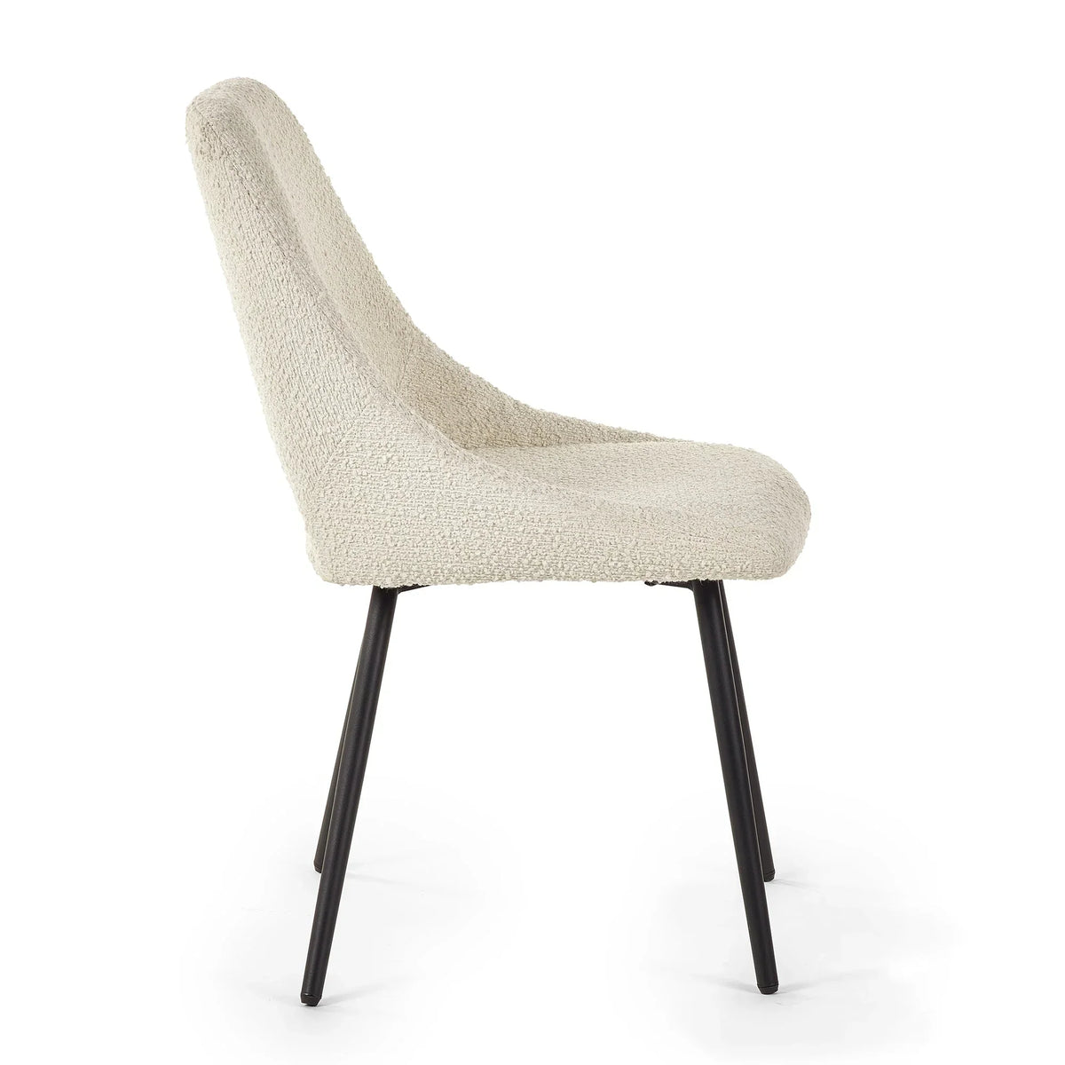 Boucle dining chair in cream fabric with black metal legs, side angle view