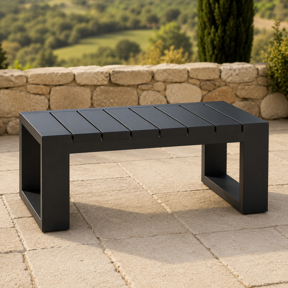Matte black metal low table with slatted top on outdoor stone tiled flooring.