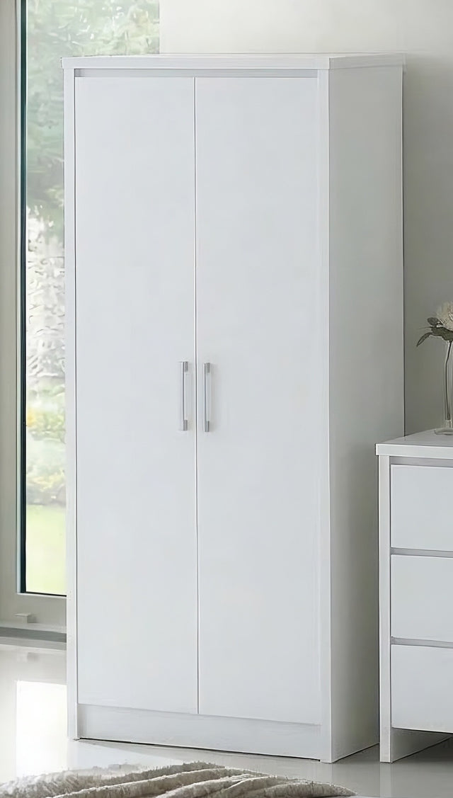 A tall white two-door wardrobe or armoire with slim silver handles, shown in a bright room next to a white three-drawer cabinet.