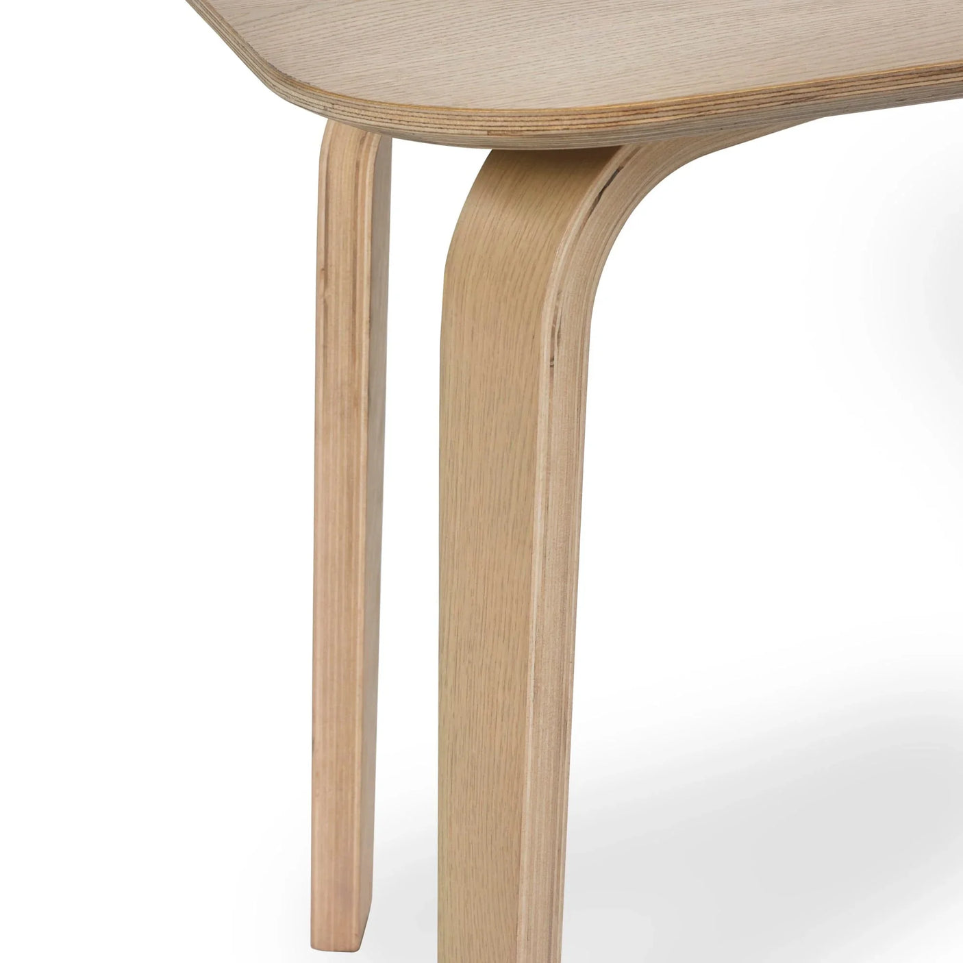 Light oak dining table leg with curved edge and wood grain detail