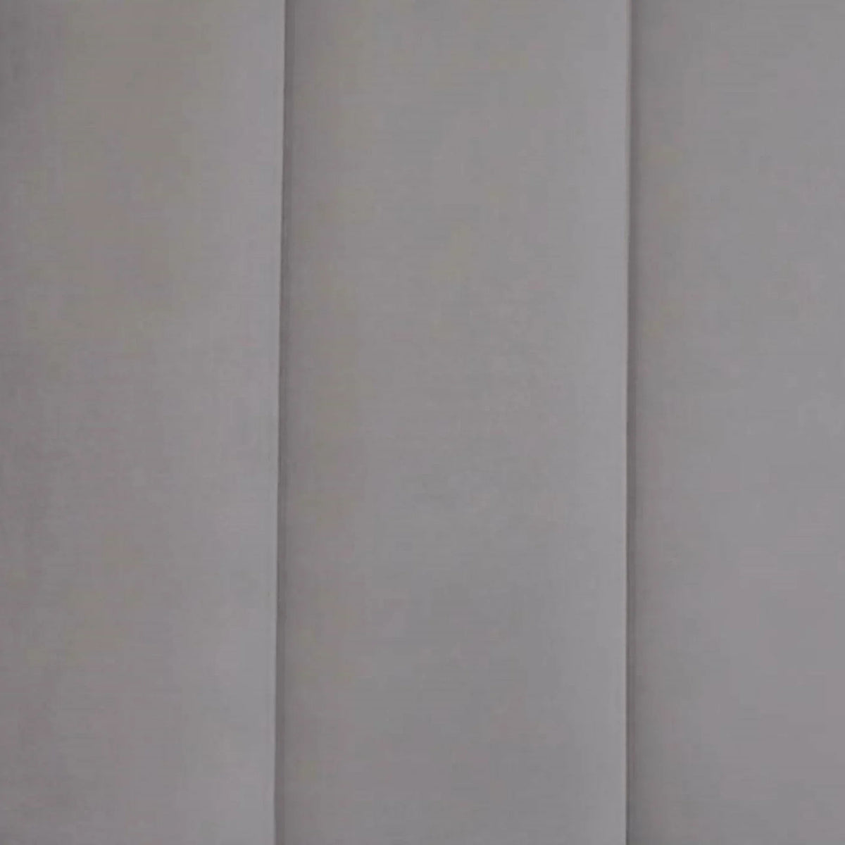 Grey upholstered headboard panel with vertical stitched seams