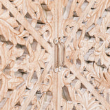 Closeup of carved wood cabinet door with floral detailing and metal handle
