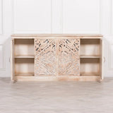 Carved wooden sideboard with sliding doors and open shelving in distressed light wood finish