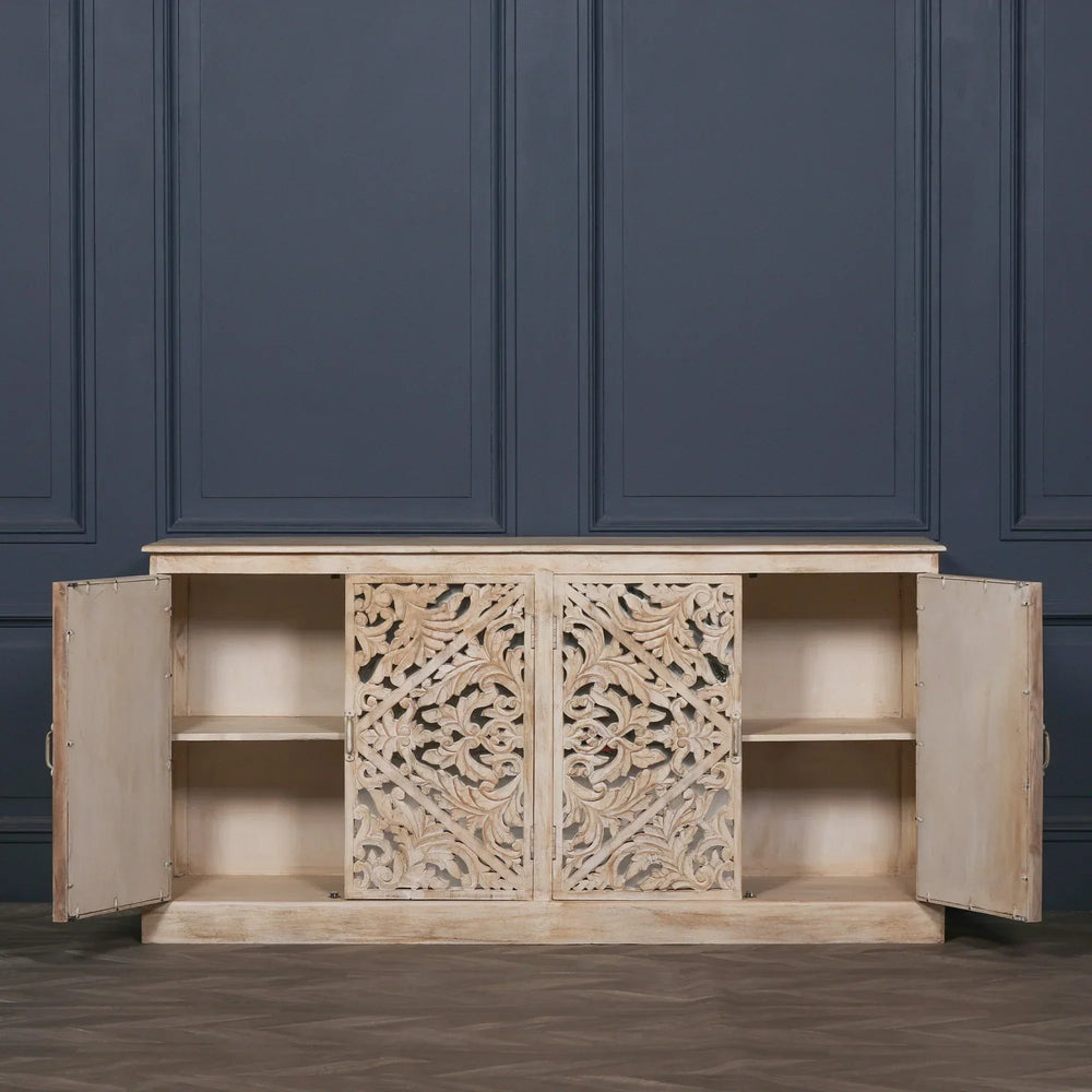 Carved wood sideboard with open doors, showcasing internal shelves and ornate front panels