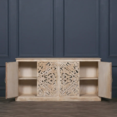 Carved wood sideboard with open doors, showcasing internal shelves and ornate front panels