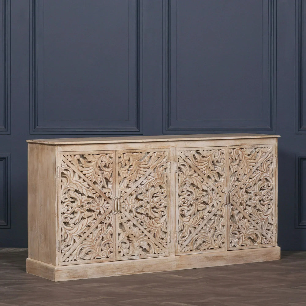 Carved wood sideboard with ornate floral patterns and four doors in neutral finish
