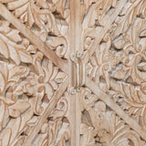 Closeup of carved wood cabinet doors with ornate floral detailing and metal handle