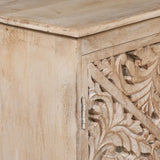Carved wood cabinet door with floral detailing and natural finish, close-up view