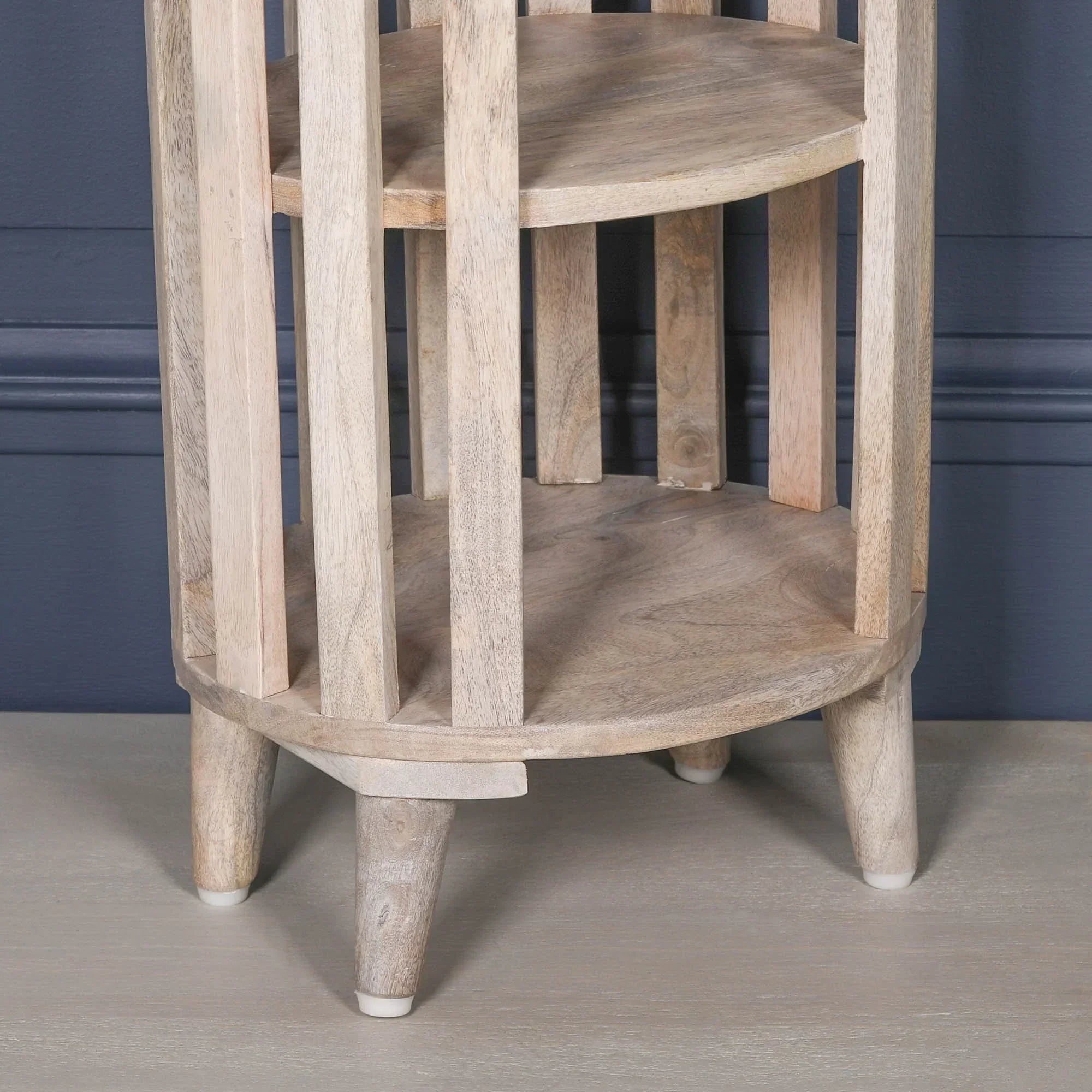 Light wood side table with two round shelves and vertical slatted frame legs