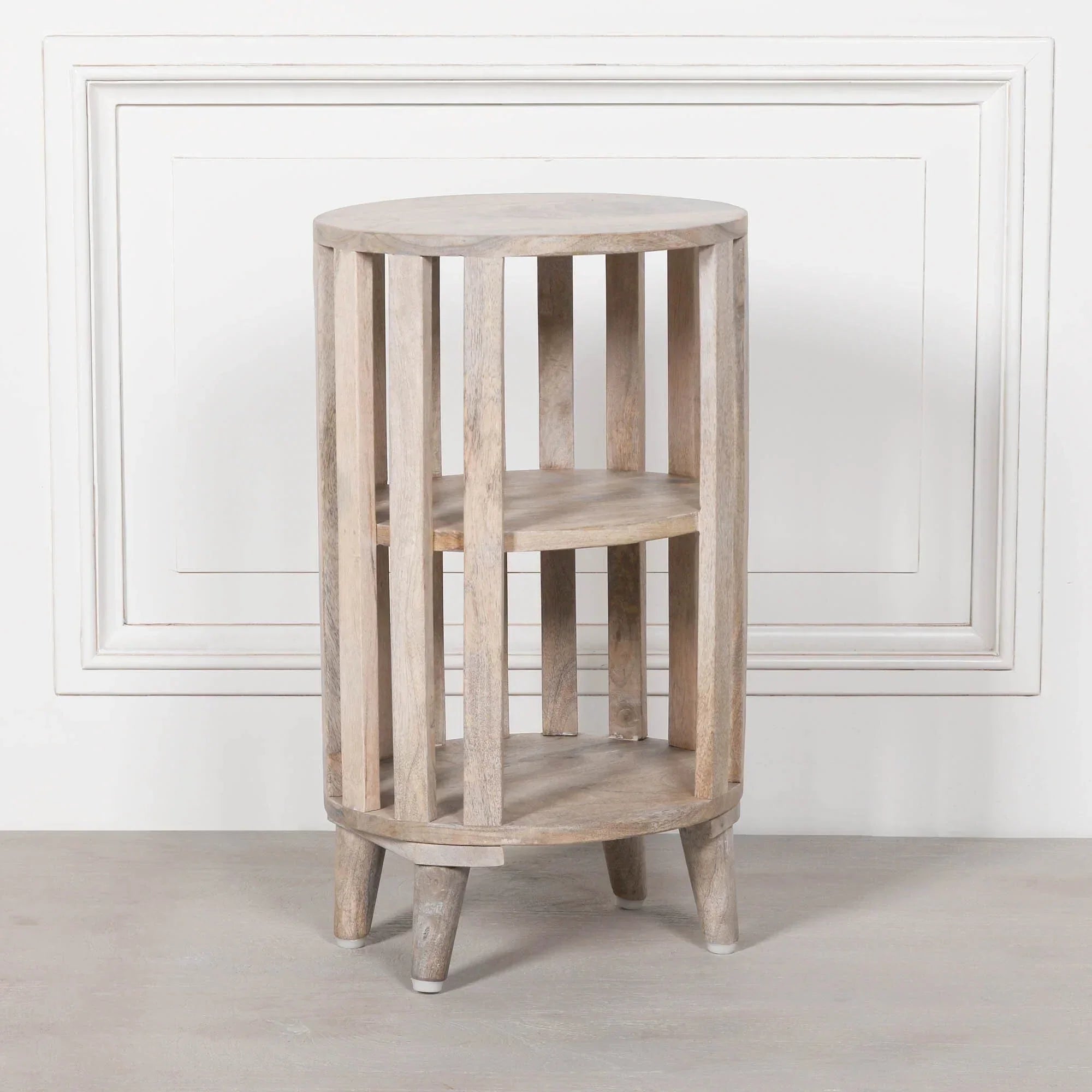 Round wooden side table with slatted sides and two shelves, natural light wood finish