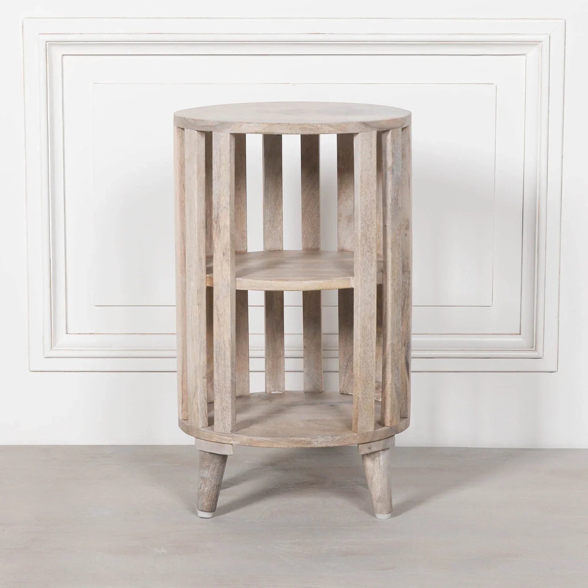 Round wooden side table with slatted sides and two shelves, light natural wood finish