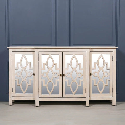 Four door mirrored sideboard with geometric wood pattern and light finish against blue wall