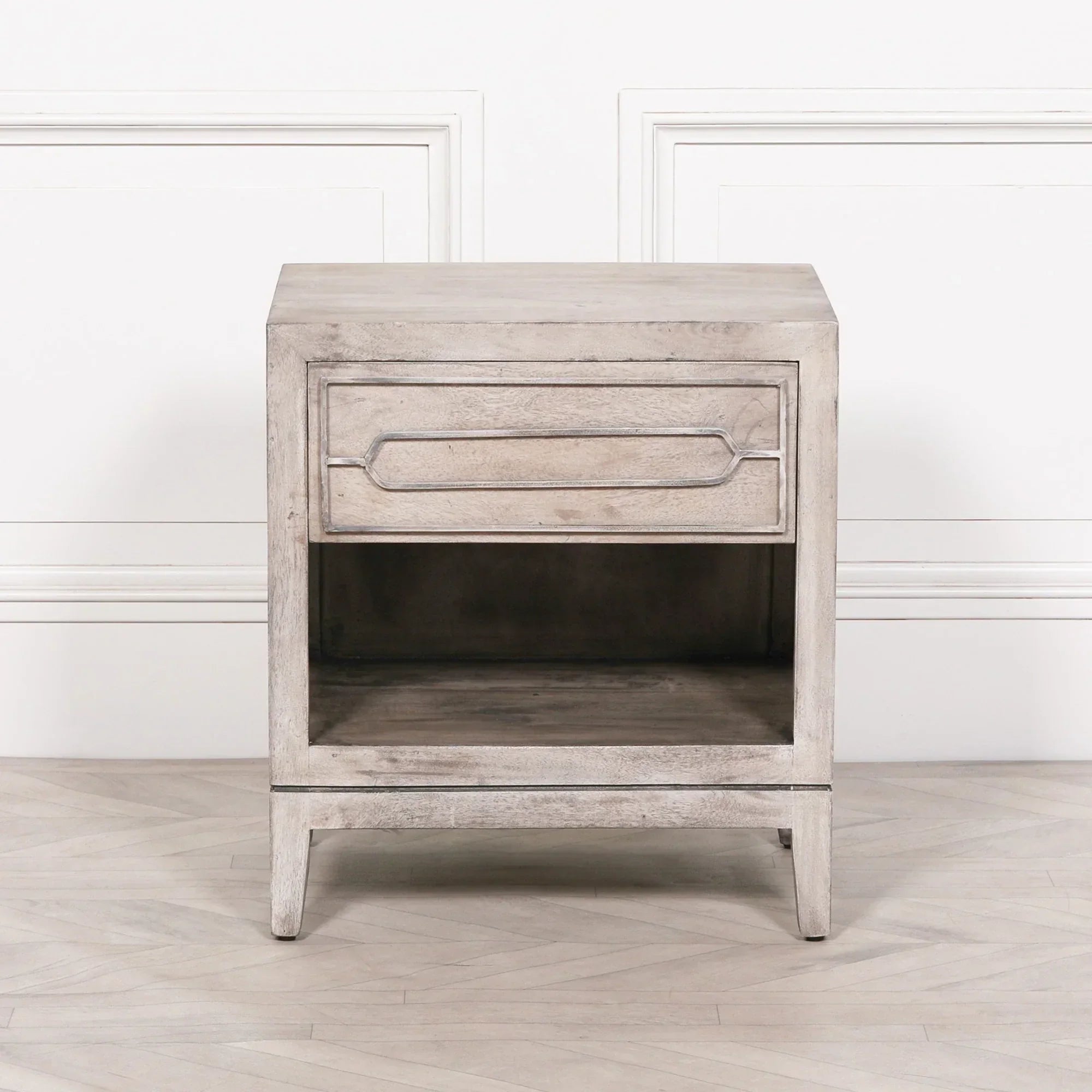 Light wood bedside table with single drawer and open shelf, front view on white background
