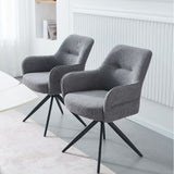 Two modern gray upholstered swivel armchairs with black metal star legs, shown in a bright, contemporary room setting.