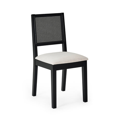 Single black wood dining chair with woven cane back and beige upholstered seat on white background.
