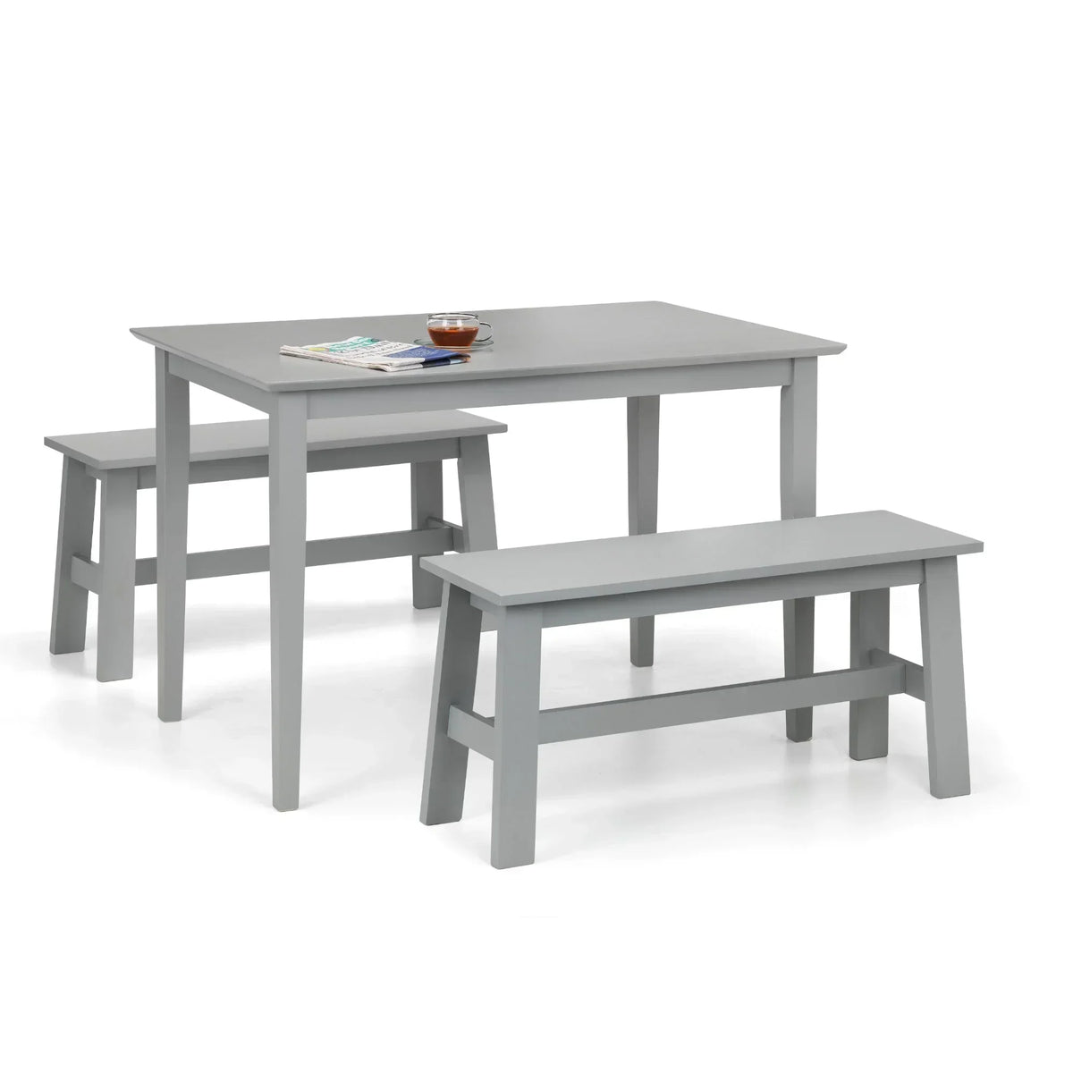 Grey rectangular dining table with two matching benches and minimal tabletop accessories