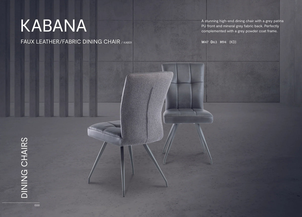 Grey faux leather fabric dining chairs with powder coated metal legs on concrete floor